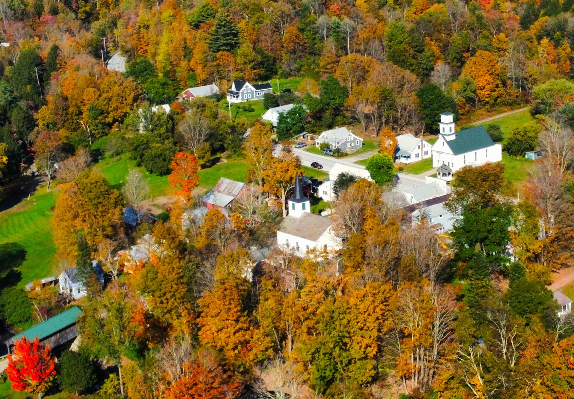 Waterville village in fall colors with telecom lines visible
